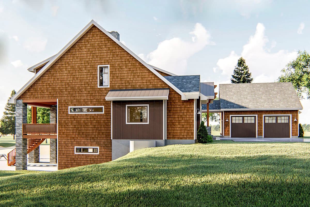 House plan exterior featuring wood shake siding, a gabled roof, stone-clad porch supports, and a detached two-car garage.