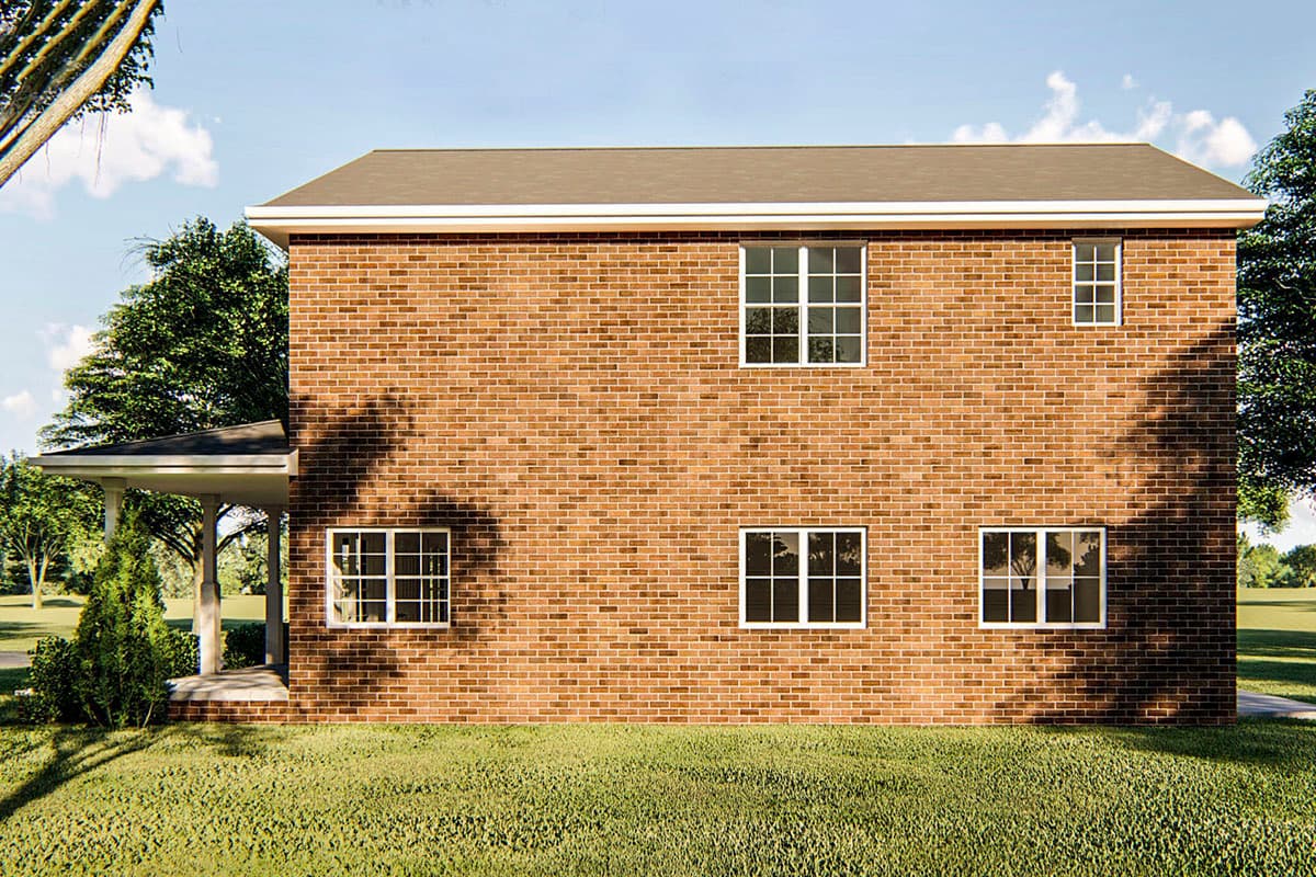 House plan exterior: Two-story brick building with a covered porch and grid-pane windows.