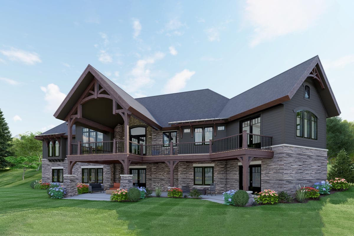 House plan exterior with stone and siding, multiple gables, exposed wood beams, and a large deck overlooking a walk-out lower level.
