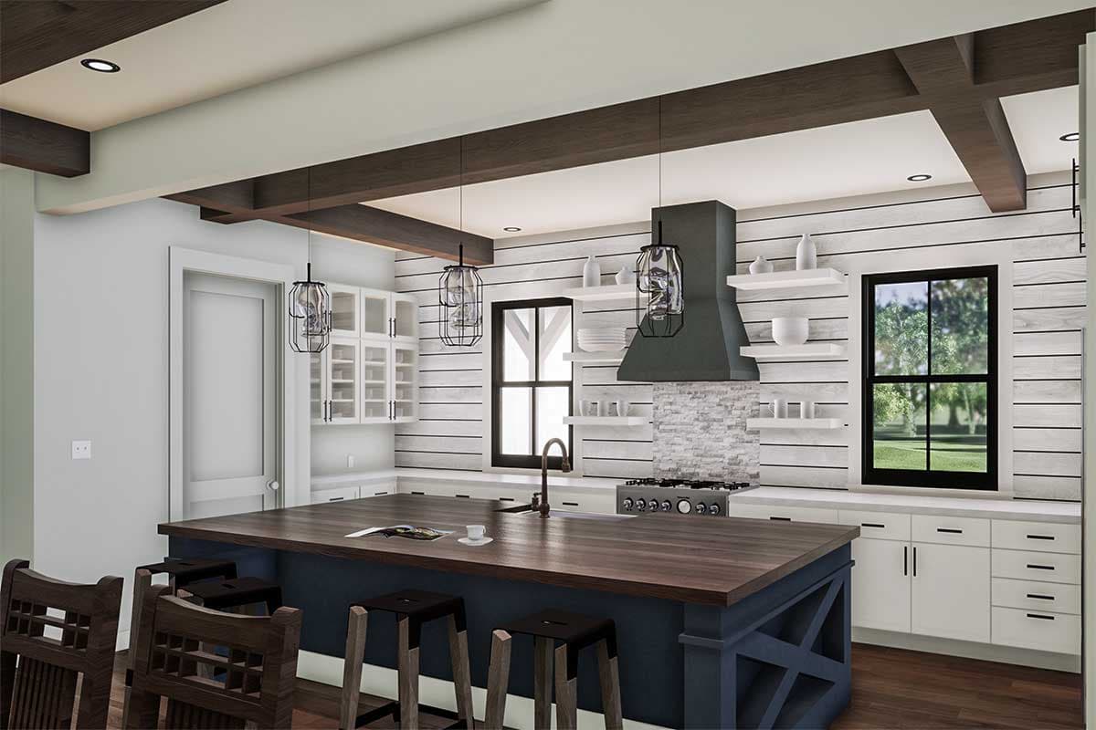 Kitchen with large island, range, range hood, shaker cabinets, and exposed wooden ceiling beams.