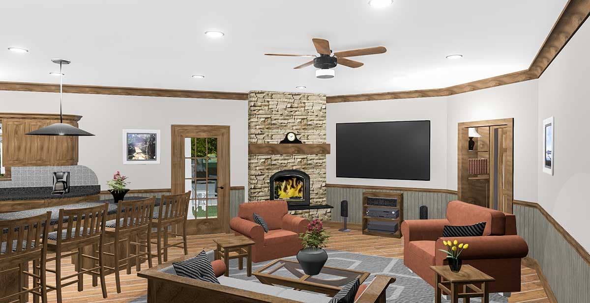 Living area with stone fireplace, television, kitchen island with bar seating, and wood trim.