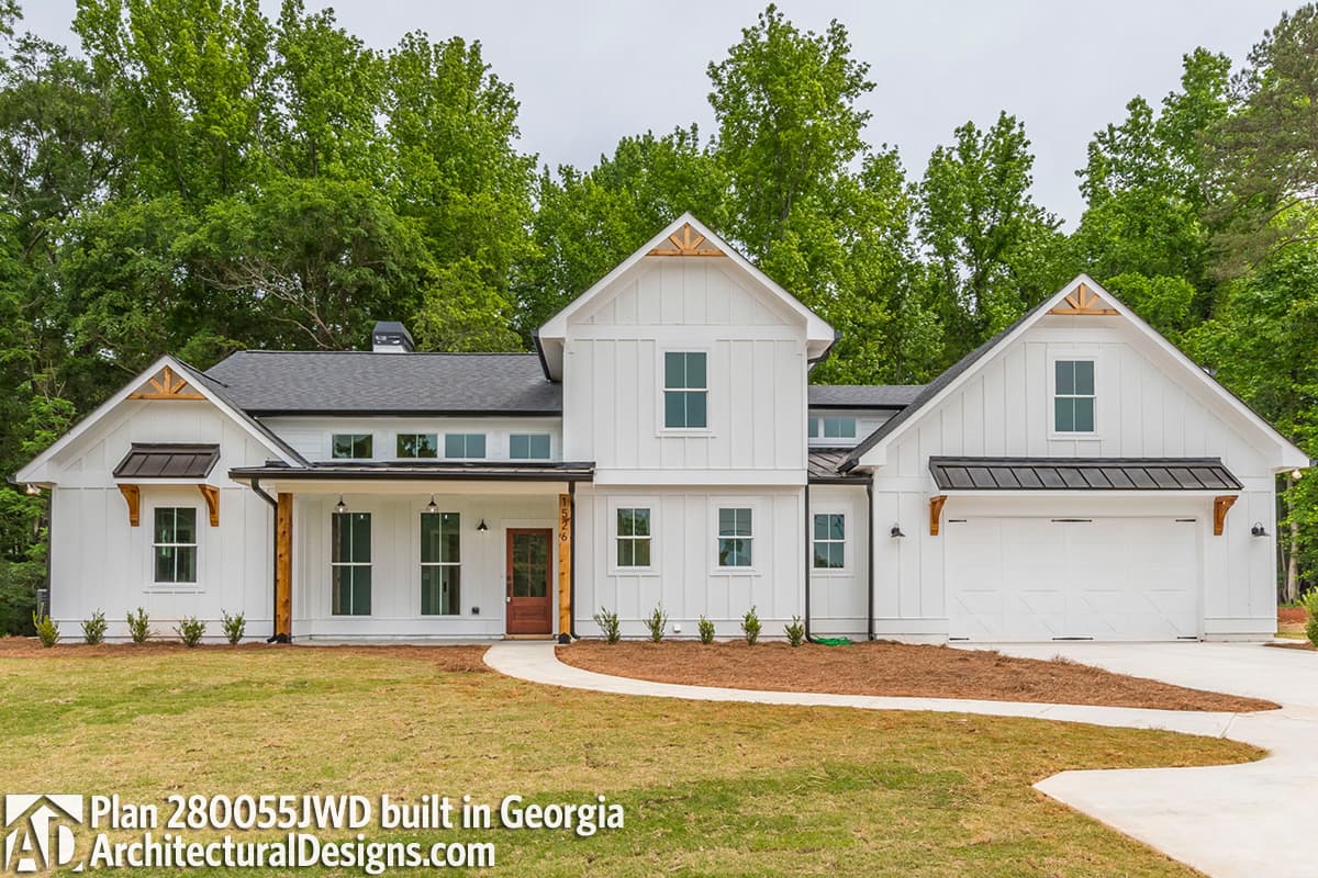 House plan exterior: Modern Farmhouse style, two stories, board and batten siding, gabled dormers, covered front porch, and attached garage.