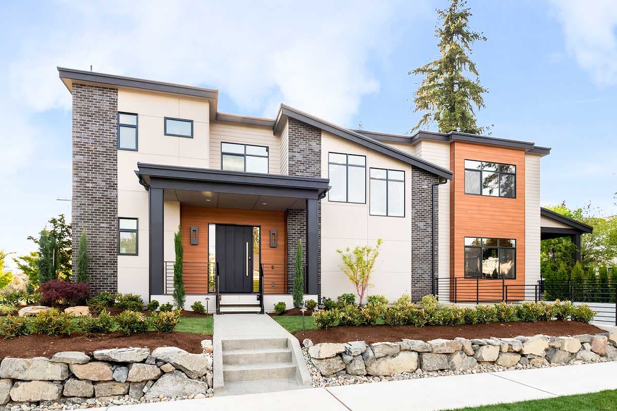 House plan exterior with modern design. Two-story home with flat rooflines, brick facade accent, and covered entry porch.