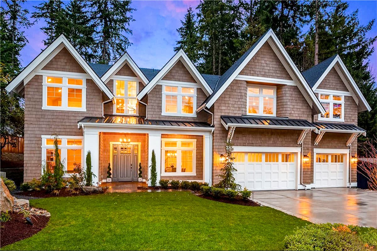 House plan exterior. Two-story Craftsman home with multiple gabled rooflines, dormers, and a covered front porch, plus attached garage.