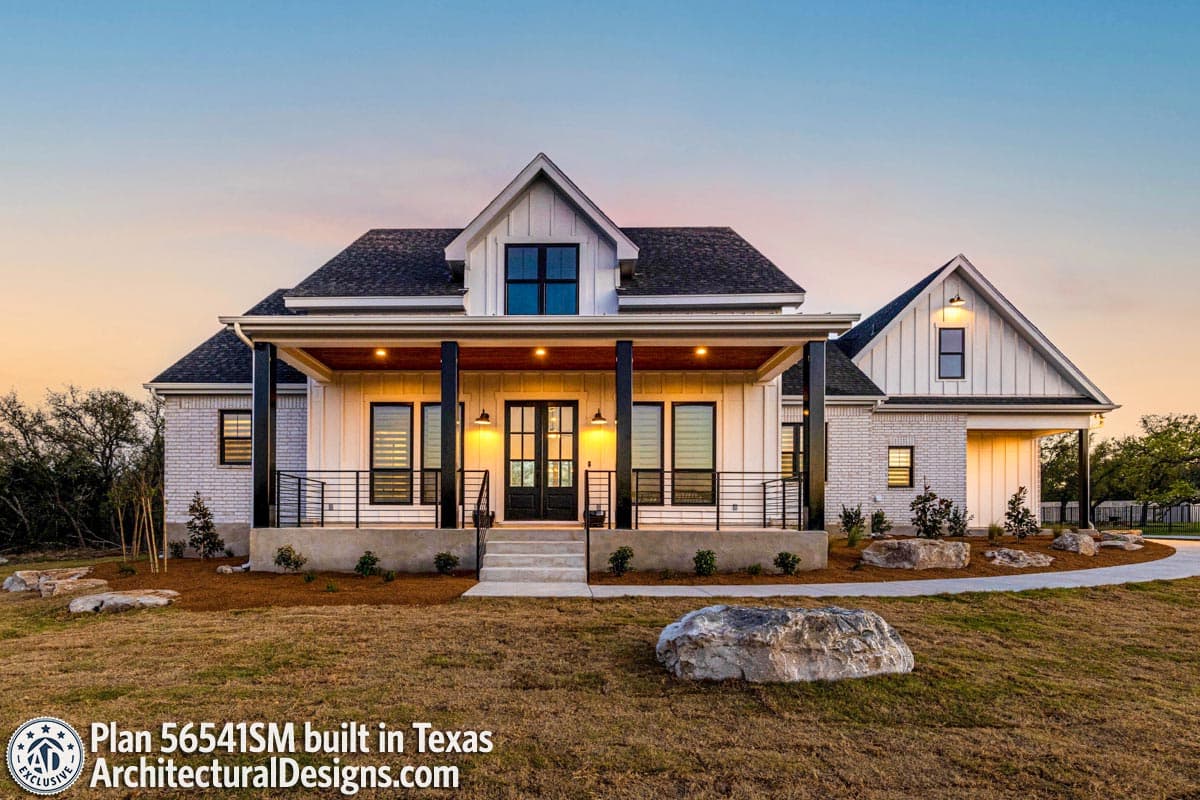 Modern Farmhouse house plan exterior with prominent gables, a covered porch with black columns, and brick and board-and-batten siding.