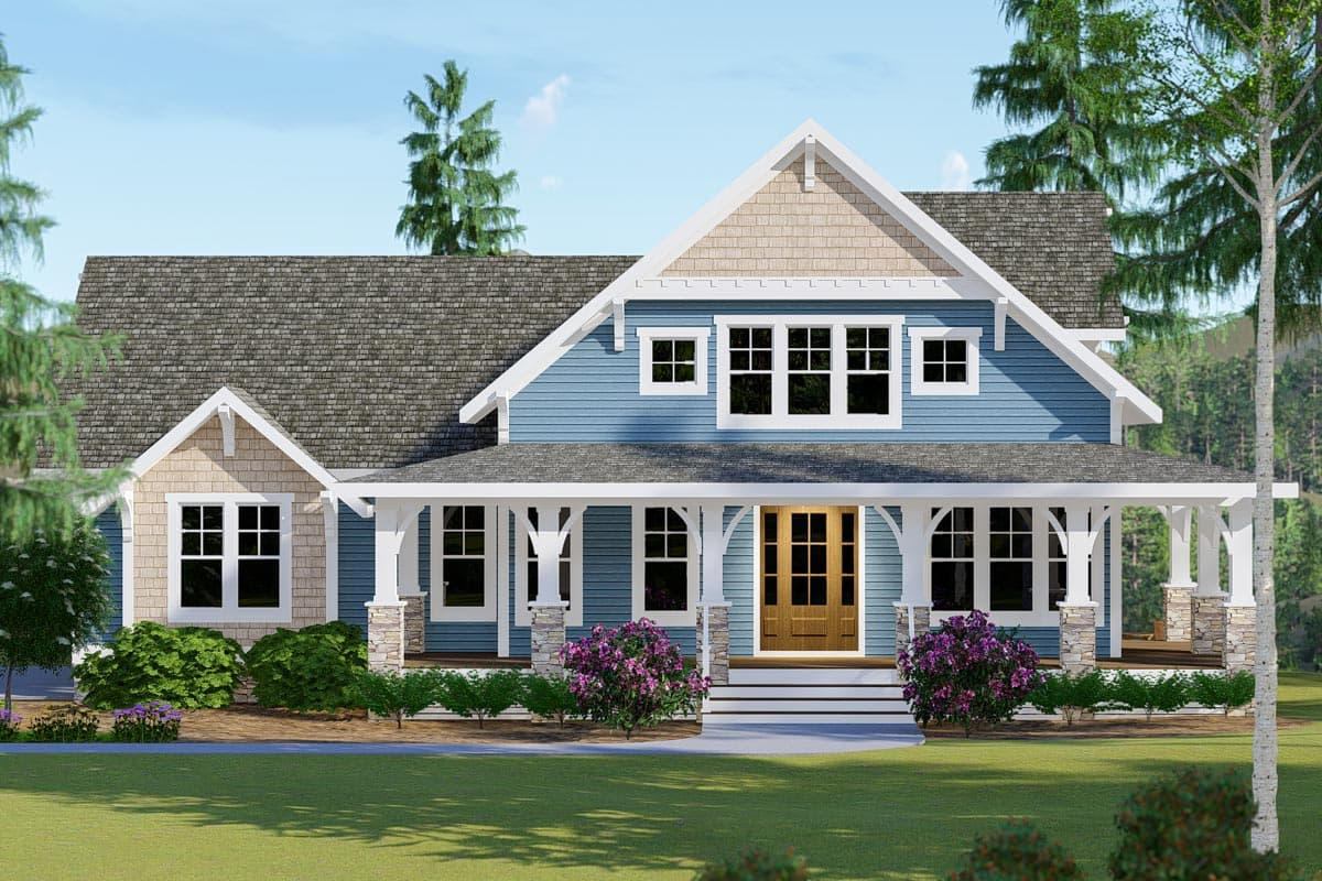 House plan exterior: Blue two-story home with a wrap-around porch, stone-clad columns, and multiple gables with cedar shakes.
