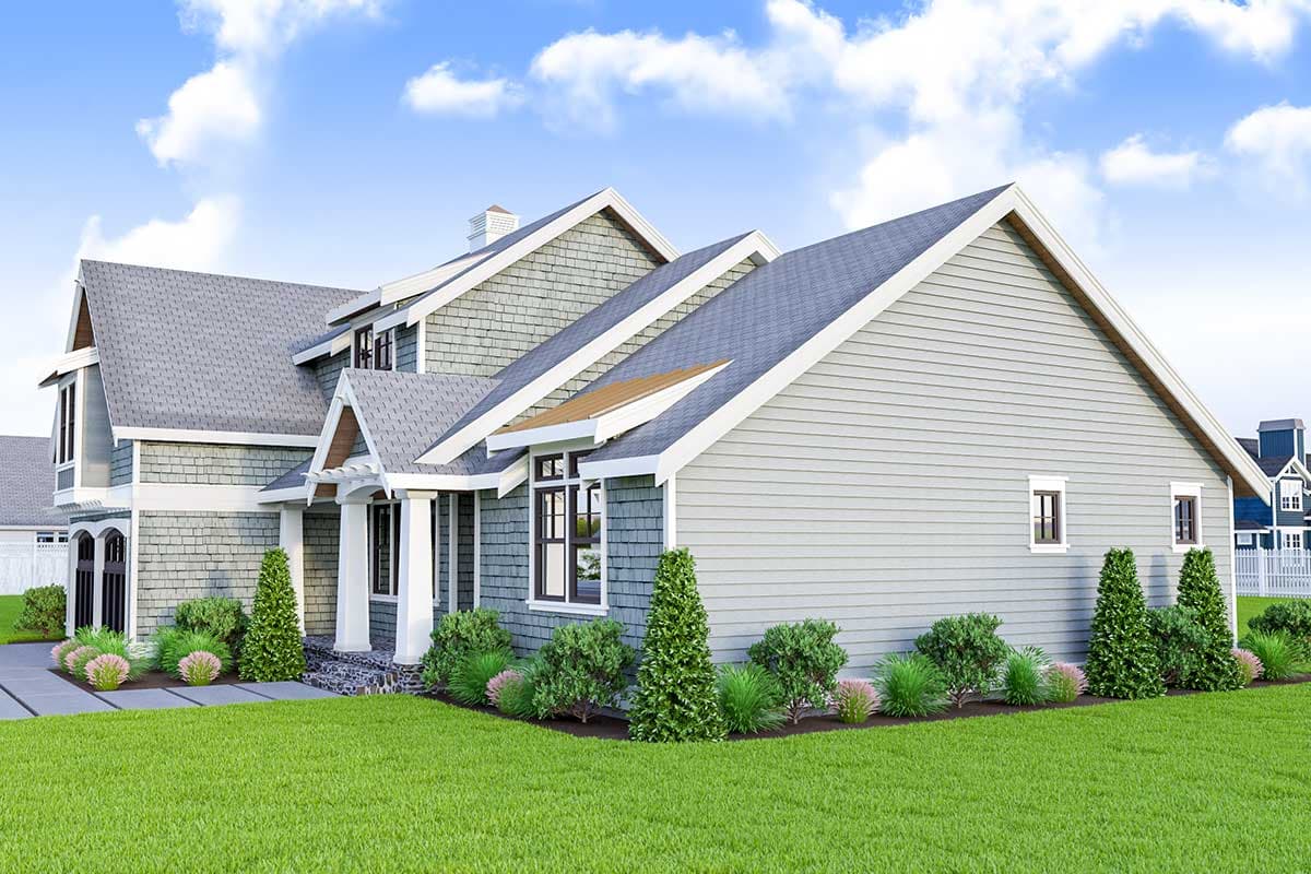 House plan exterior with a mix of shingle and lap siding, prominent gables, and a covered entryway with stone accents.