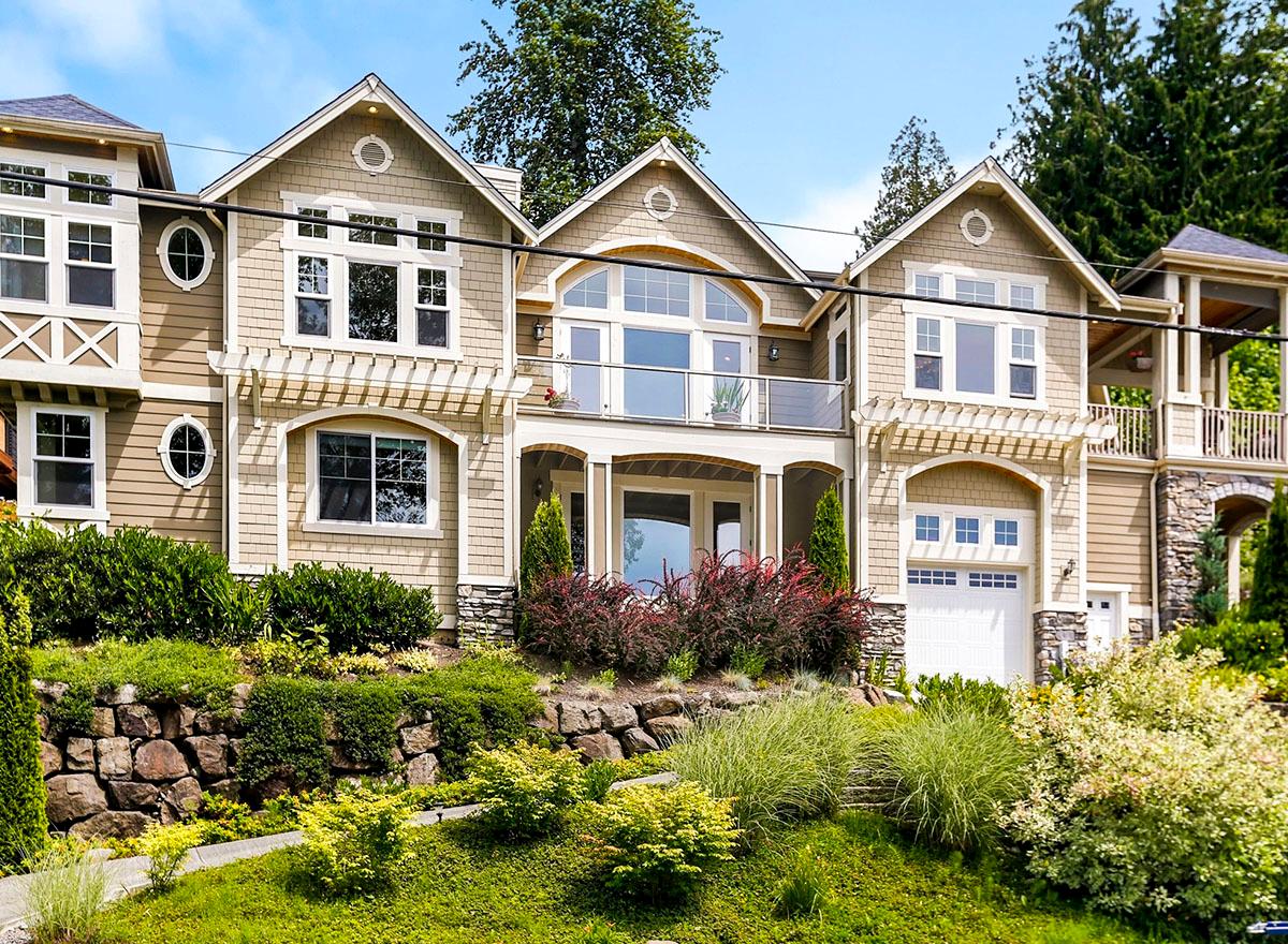 House plan exterior featuring Craftsman architectural style with multiple gables, a pergola, and a covered porch. Two stories.