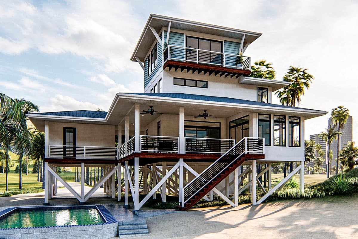 House plan exterior: Modern stilt house with multiple levels, wraparound deck, gabled rooflines, and angled support beams.