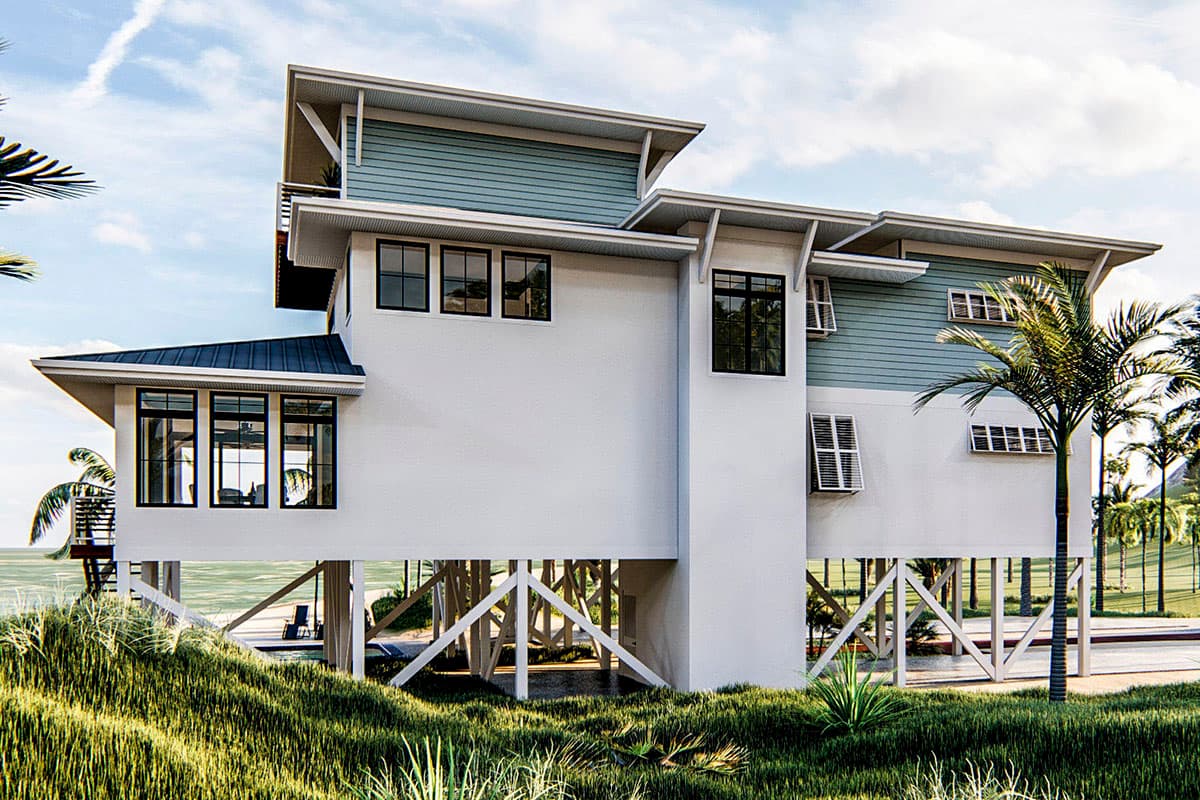 House plan exterior: Multi-story coastal home on stilts with light blue siding, white stucco, and angular rooflines.