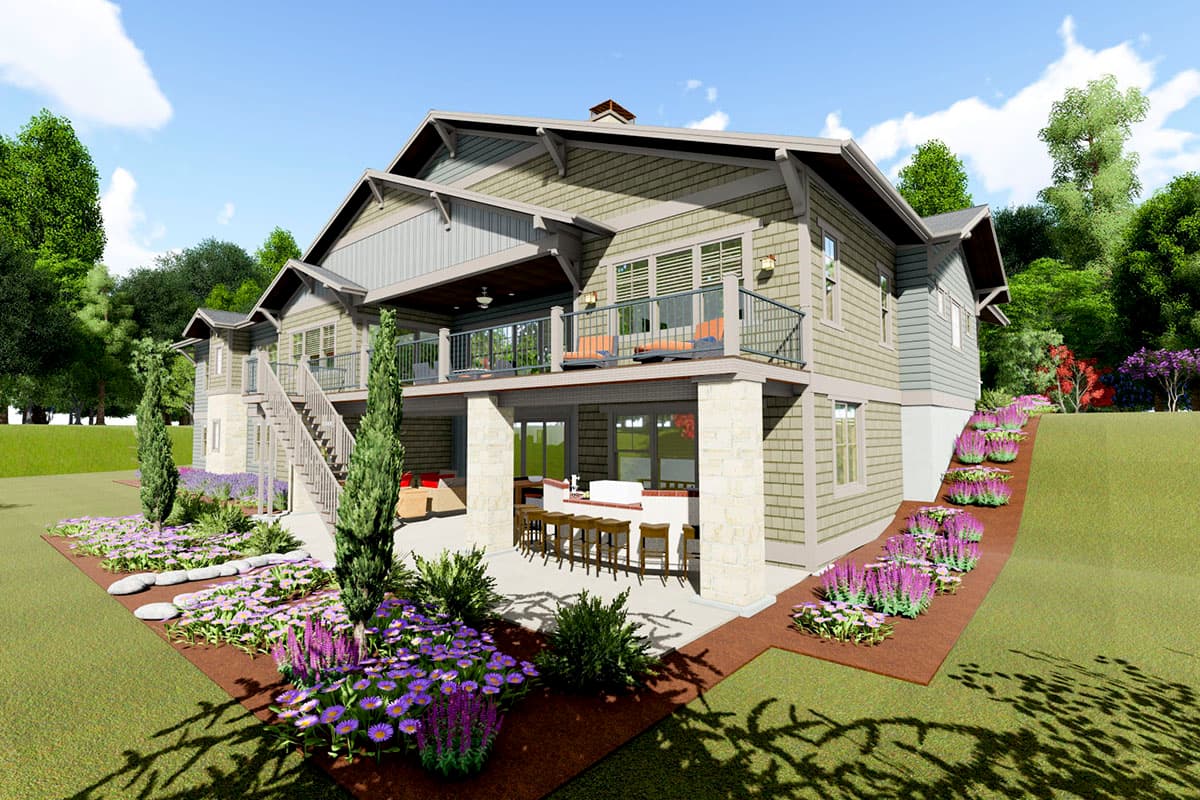 House plan exterior with stone accents, multiple gables, a covered deck, and lower-level outdoor kitchen.