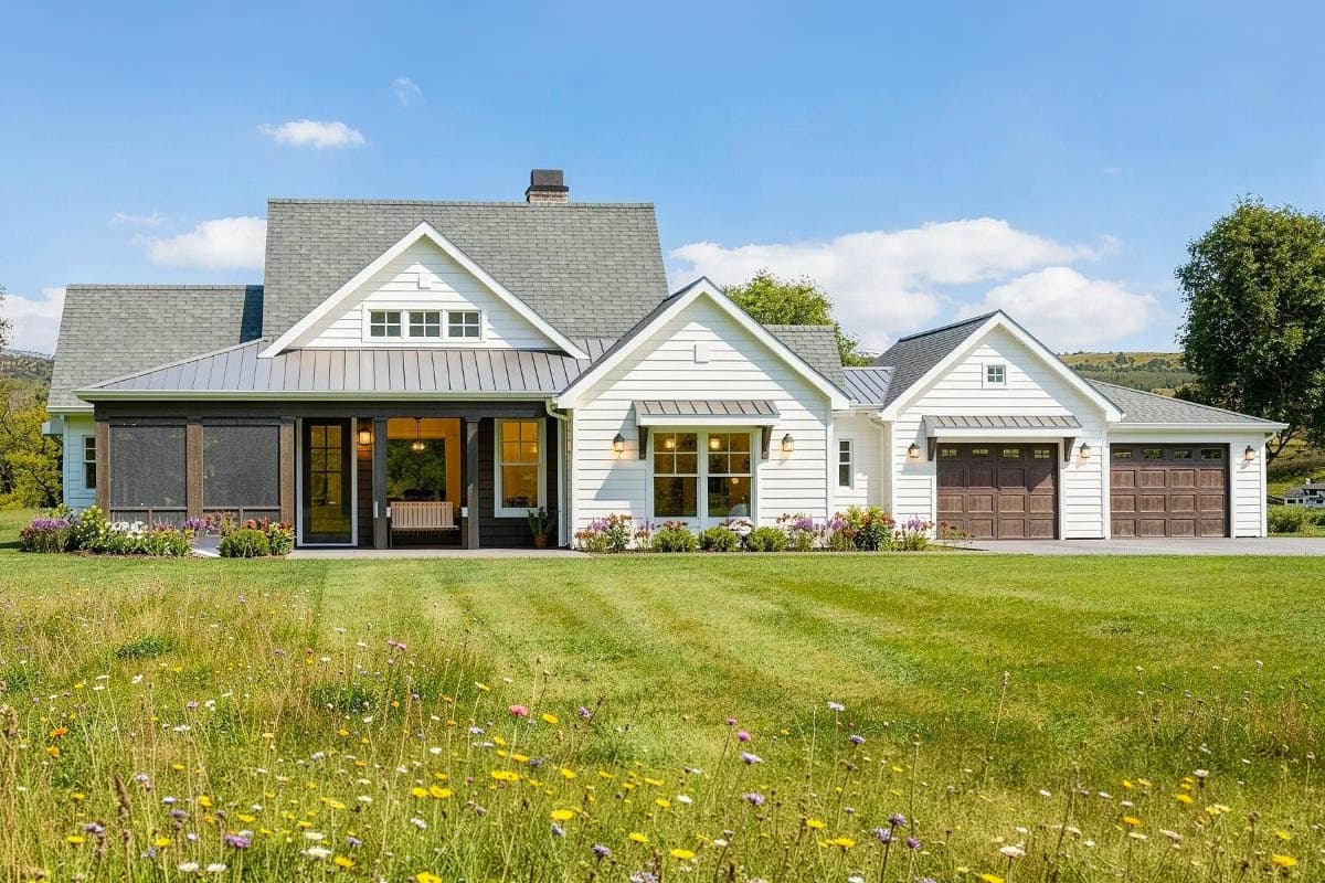 House plan exterior featuring a Modern Farmhouse style with a gable roof, covered porch, and attached garage. Two story. Includes shed dormers.