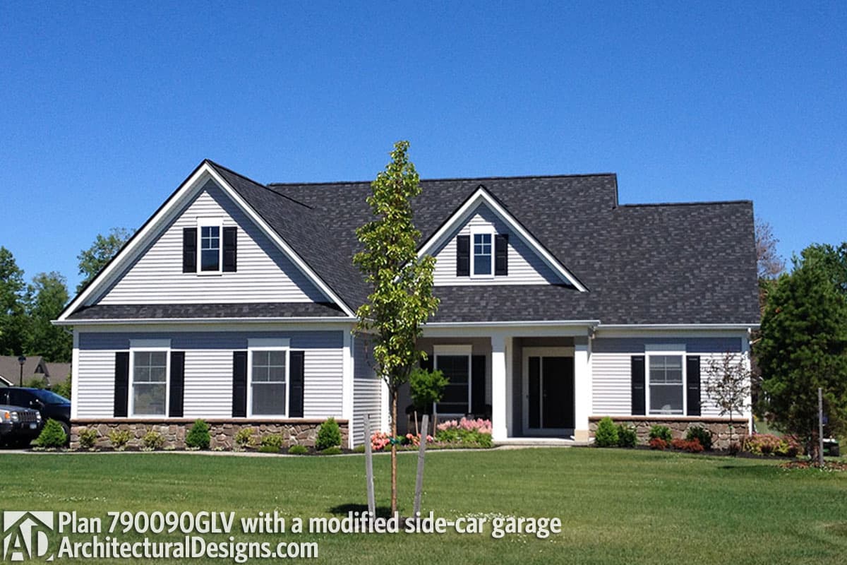 House plan exterior: Gable dormers, front-entry porch, and modified side-car garage.  Stone foundation detail.