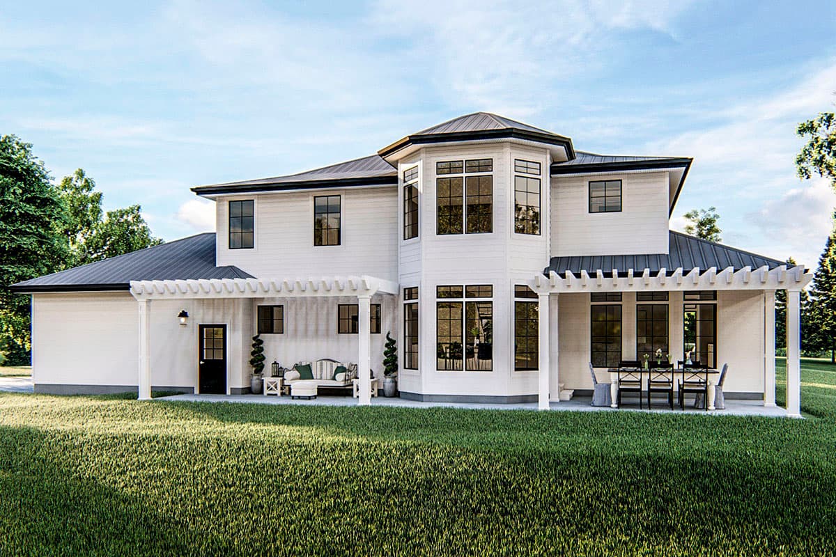 House plan exterior of a two-story white house with a dark metal roof, bay windows, and covered patios with pergolas.