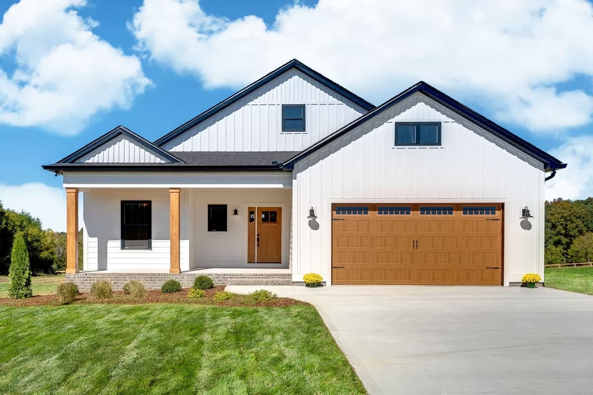House plan exterior. Modern farmhouse style with gabled roof, front porch with columns, and attached garage. Two stories.