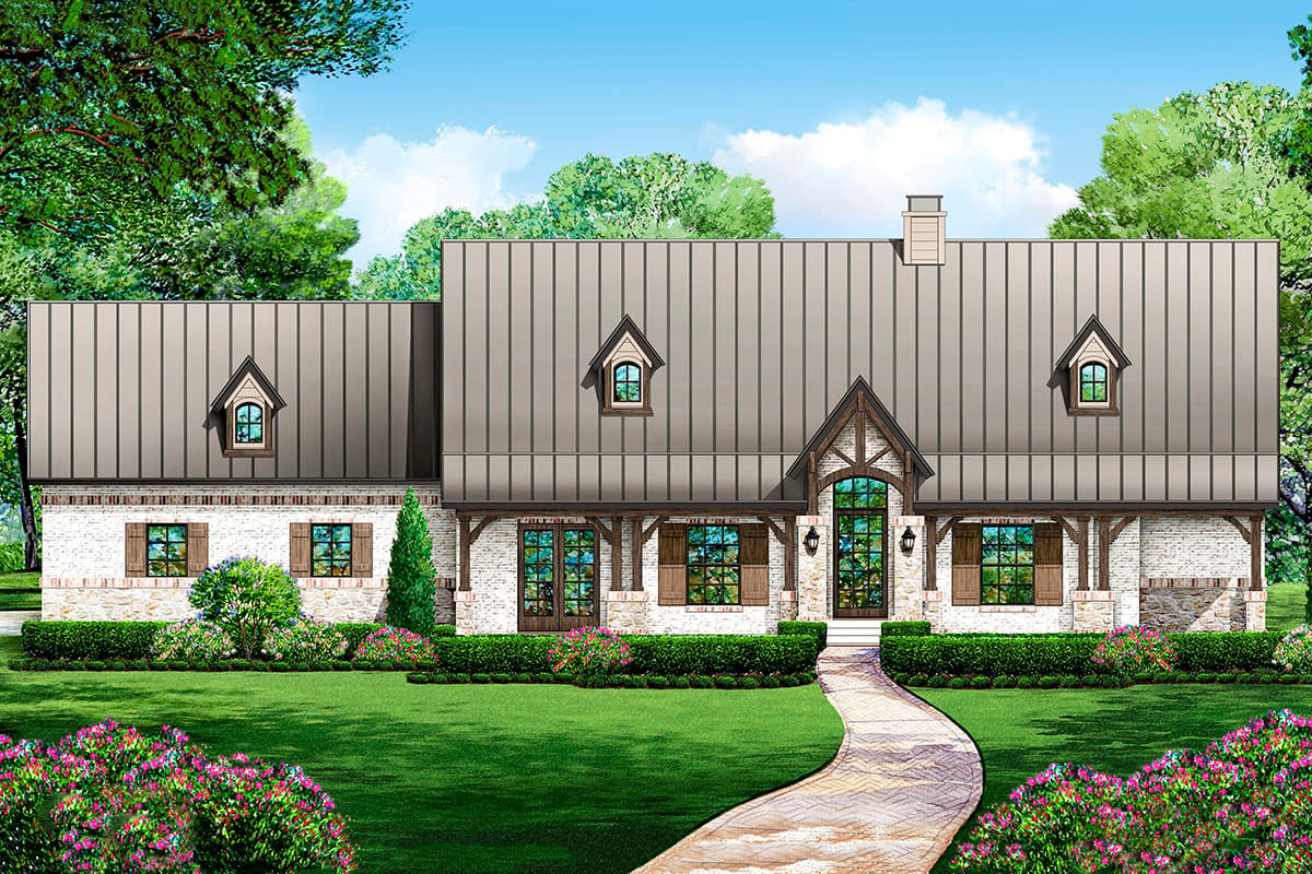 House plan exterior. One-story French Country style home with metal roof, dormers, and gabled entry. Brick and stone facade with wooden shutters.