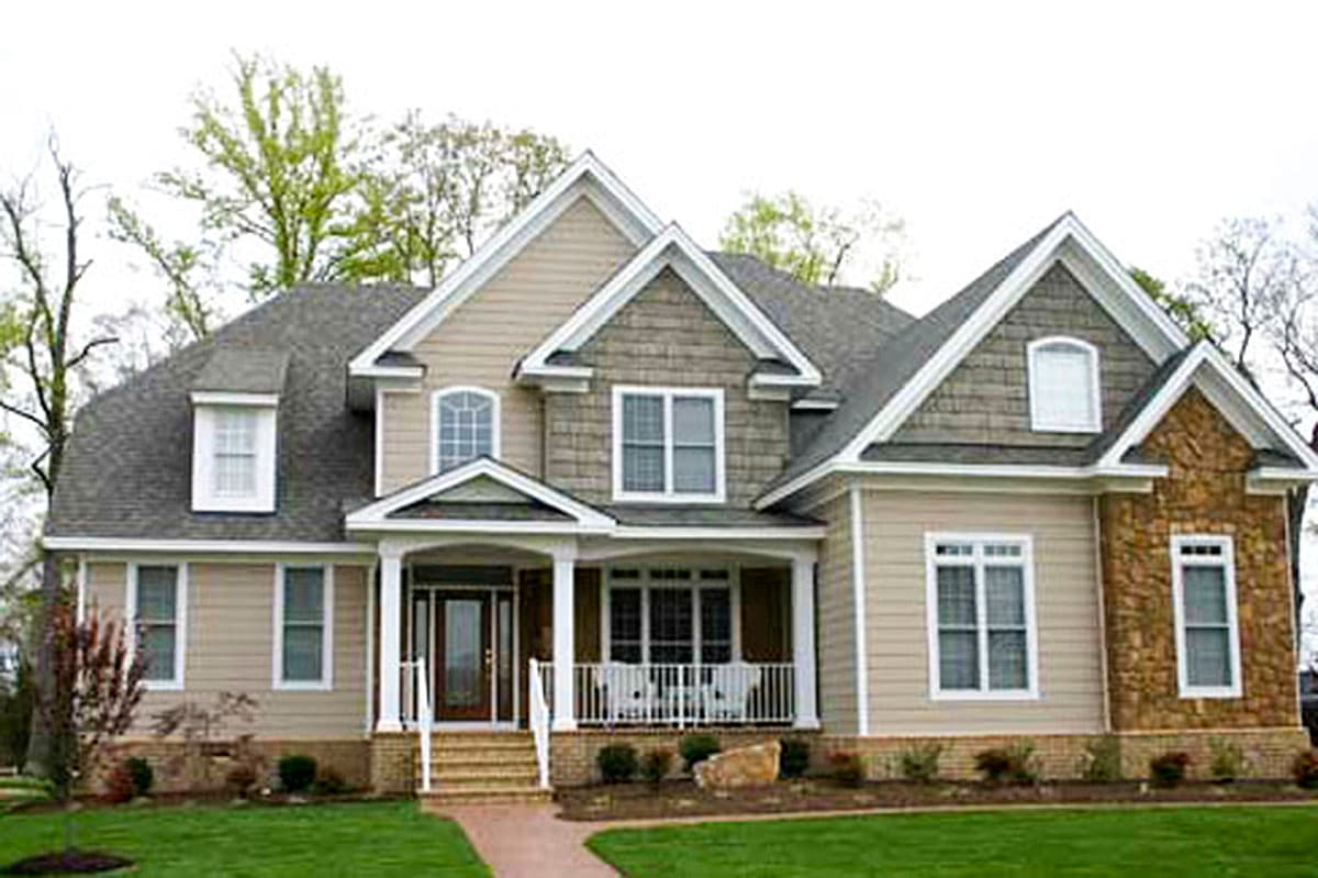 House plan exterior of a two-story home with a covered front porch, dormer window, and stone accents.
