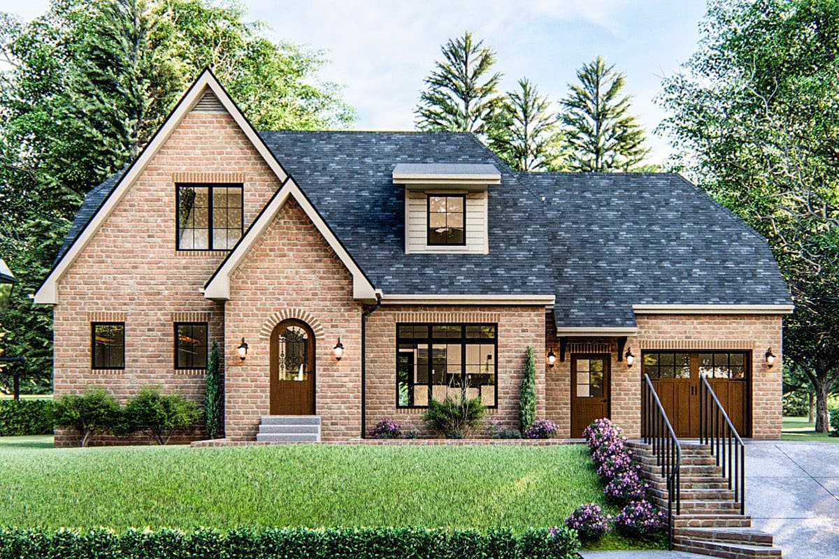 House plan exterior. Two-story brick home with gabled roof, dormer, and arched entryway. Attached garage and multiple windows are also visible.