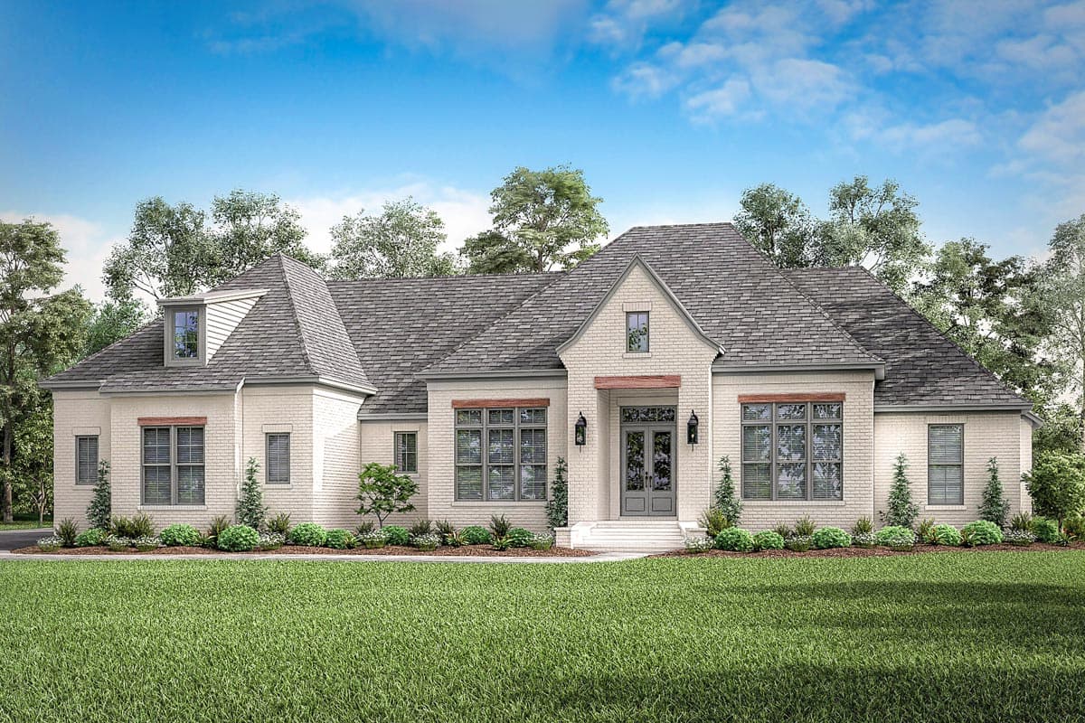 House plan exterior: One-story brick home with a steeply pitched roof, dormers, and a covered front entrance with double doors.