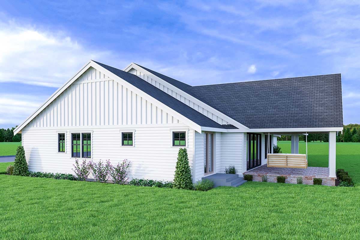 House plan exterior, white siding, prominent gables, porch with swing, and dark-trimmed windows.