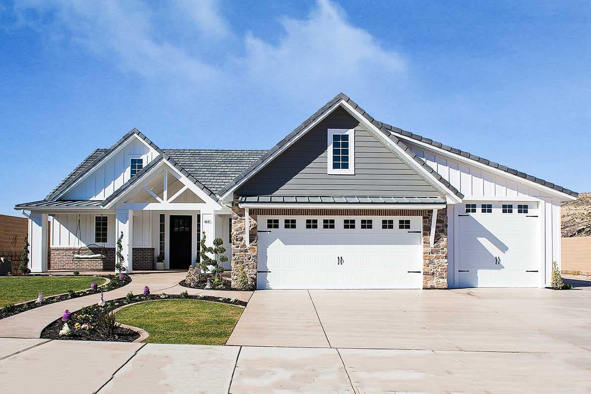 House plan exterior with Craftsman style, single story, and a gable roof. Features include stone accents, a covered entry, and a multi-car garage.