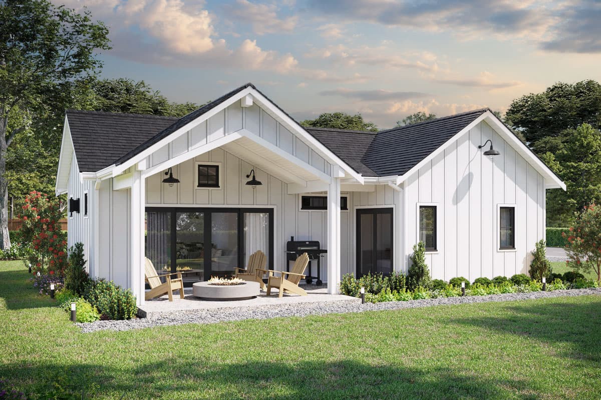 House plan exterior. Modern Farmhouse style with a single story, shed roof, and covered patio area with a fire pit.