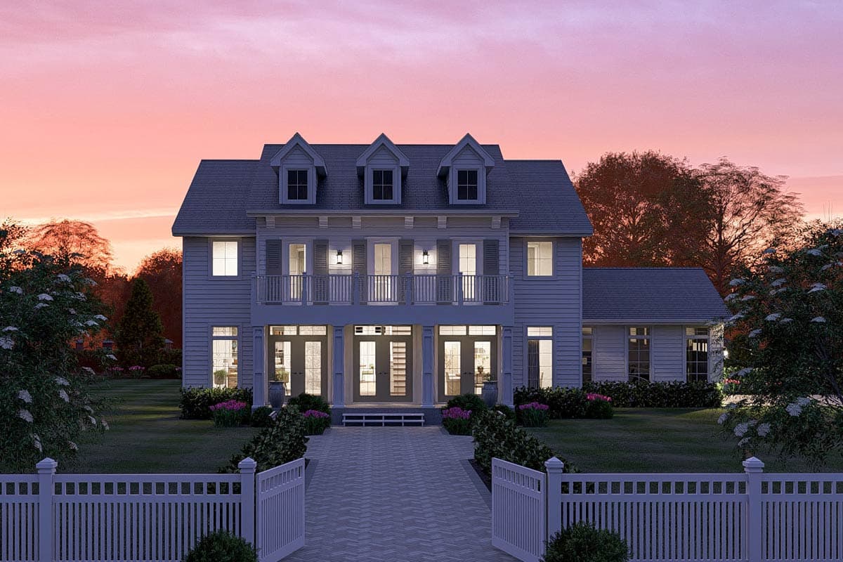 Two-story house plan exterior with multiple dormers, upper balcony, and a central covered entryway.