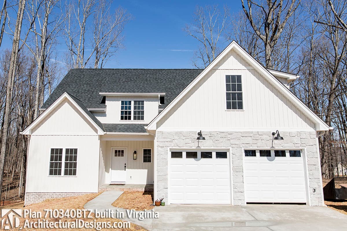 Modern Farmhouse house plan exterior: two stories, white board and batten siding, stone accent, and a two-car garage.