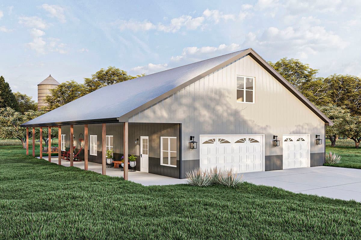 House plan exterior: Barn-style structure with metal siding, wraparound porch, and a three-car garage.