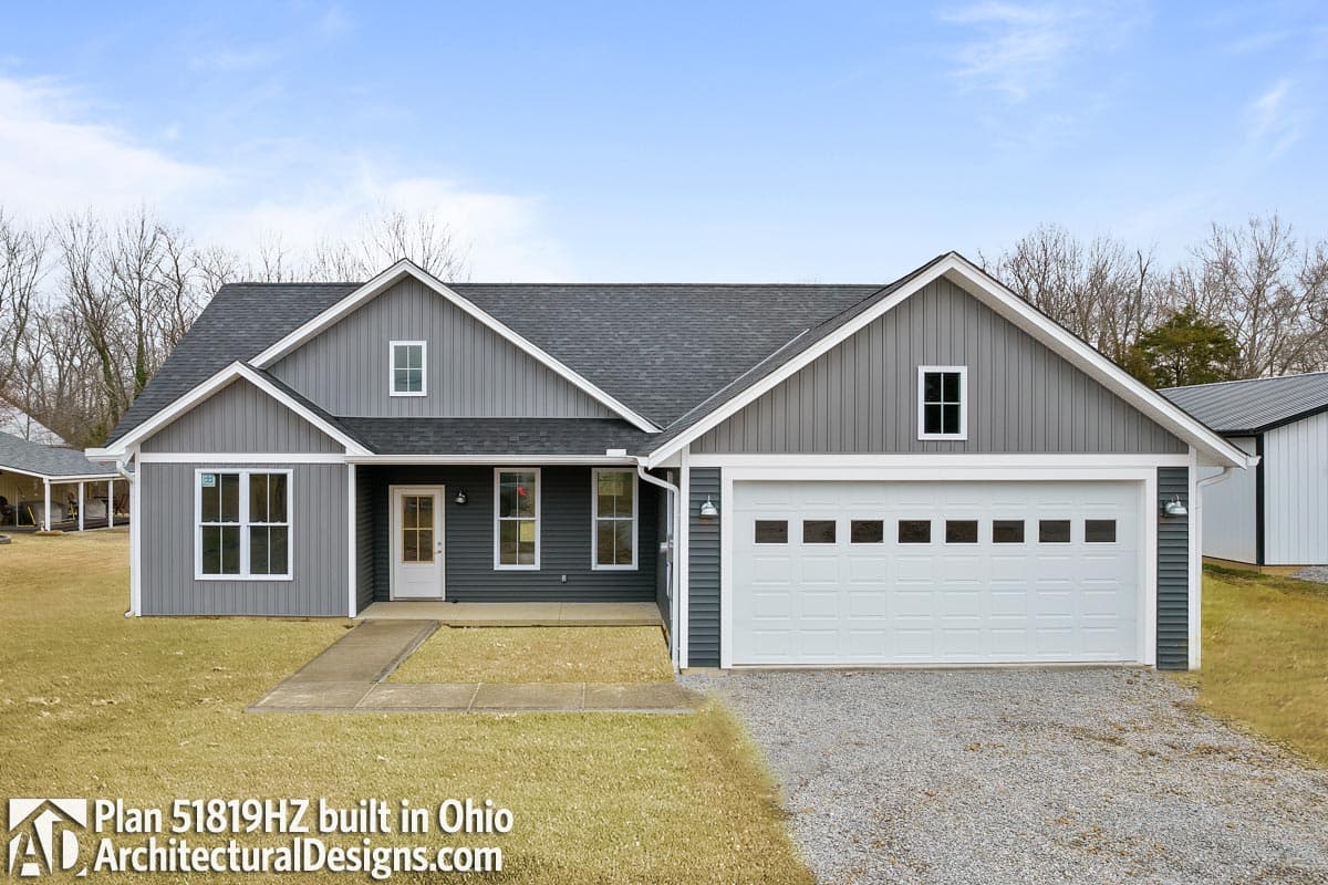 Modern Farmhouse house plan exterior with a two-car garage, gables, and dormer windows.