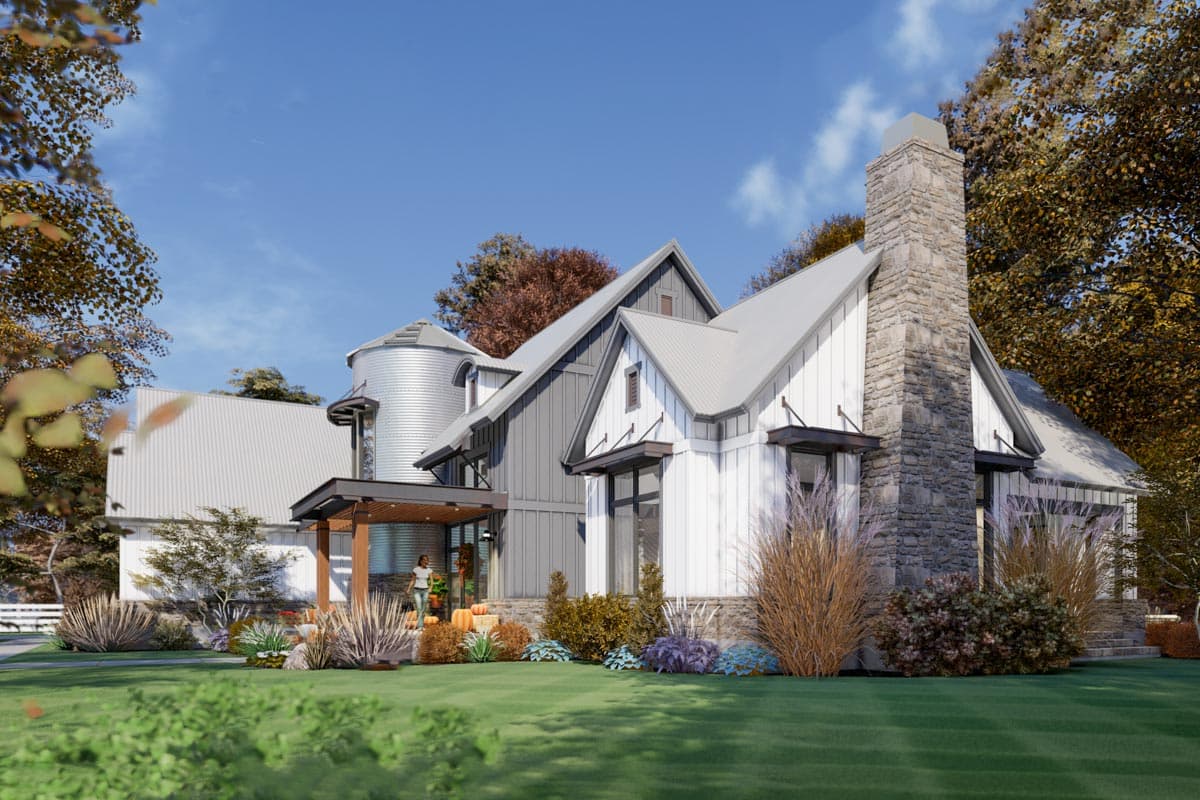Modern Farmhouse house plan exterior with silo element, stone chimney, gables, and metal roof.