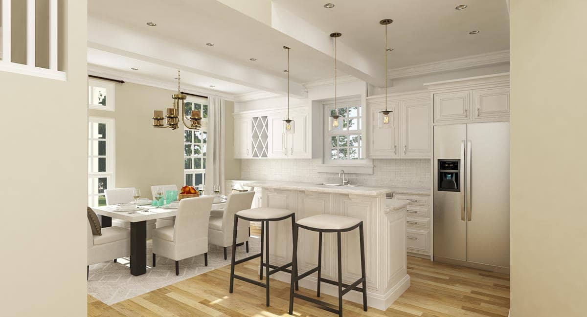 Open-concept kitchen and dining area with island, white cabinetry, stainless steel appliances, and dining set.