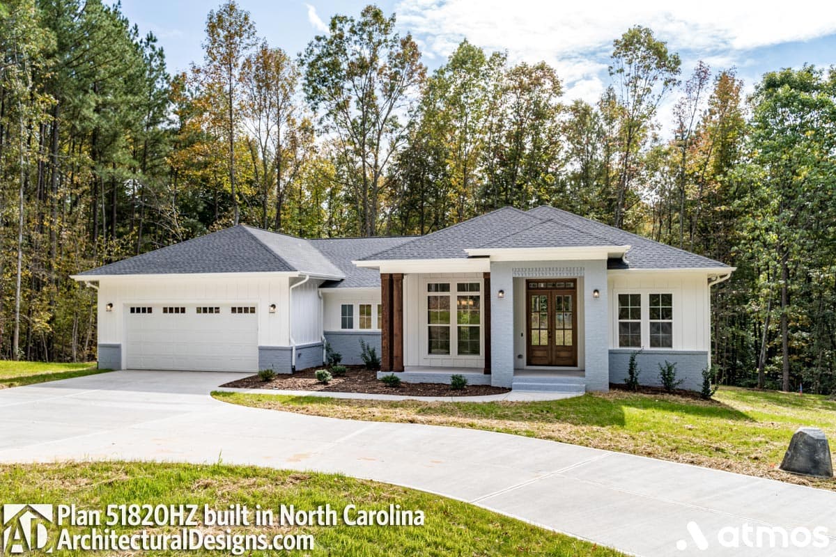 Modern Ranch house plan exterior with a two-car side-entry garage, wood-accented entry, and prominent gable rooflines.
