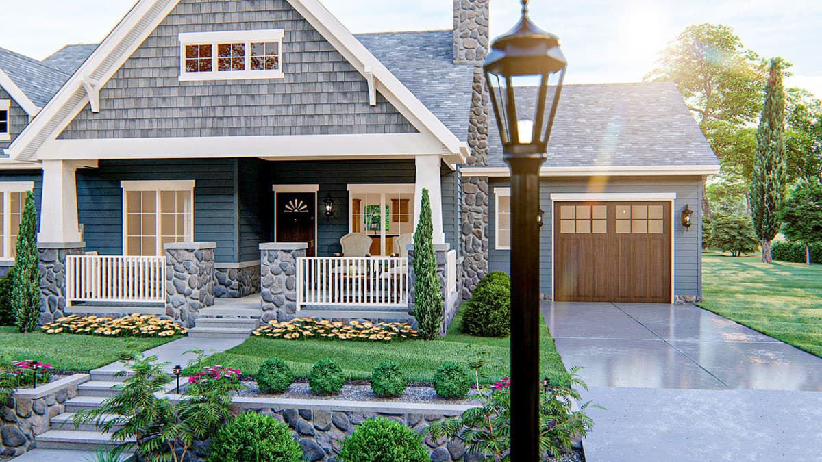 House plan exterior: Craftsman style, two stories, with stone accents, front porch, gabled dormers, and attached two-car garage.