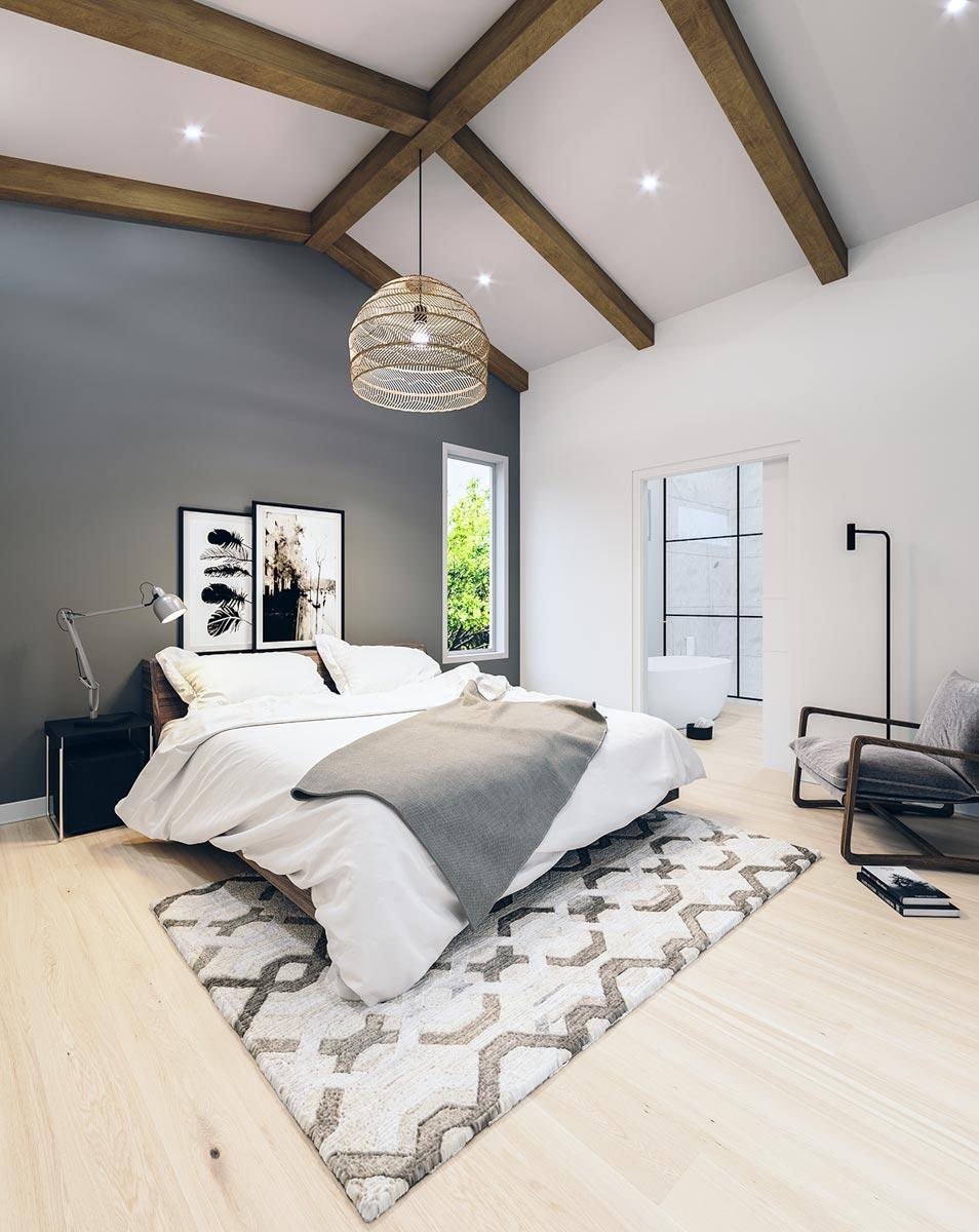 Bedroom with vaulted ceiling, exposed wood beams, a large pendant light, and an open-layout ensuite bath.