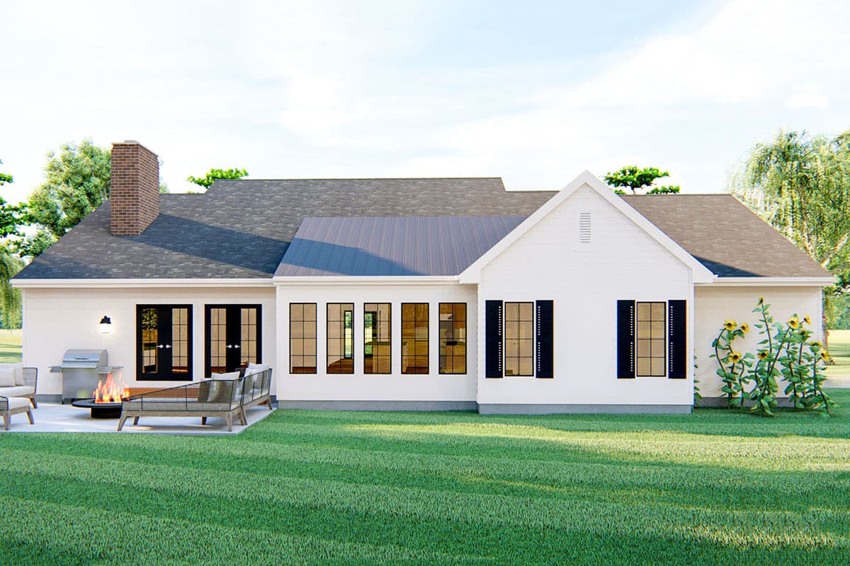 House plan exterior: Modern Farmhouse style, one story, brick chimney, metal roof section, patio with grill and fire pit.