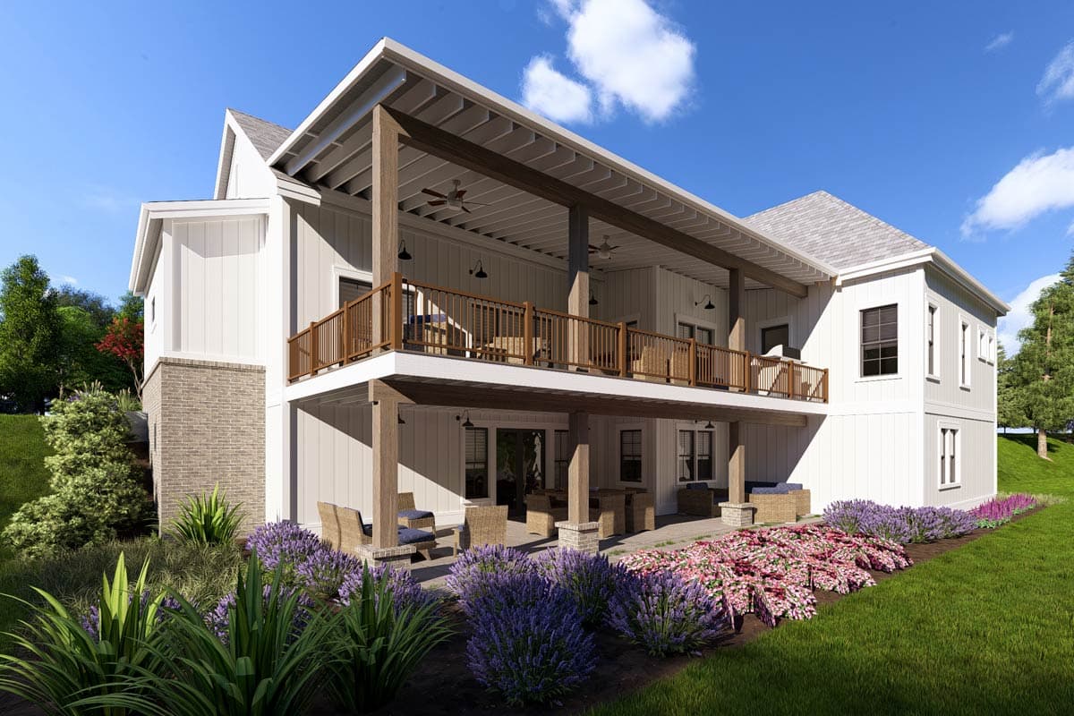 House plan exterior with a two-story design, covered upper deck with railing, and stone foundation accents.