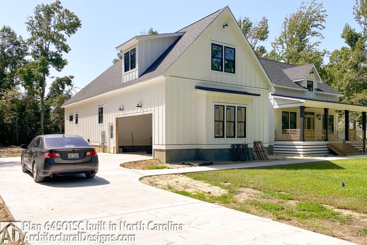 Modern Farmhouse house plan exterior with board and batten siding, side-entry garage, gable dormers, and covered porch.