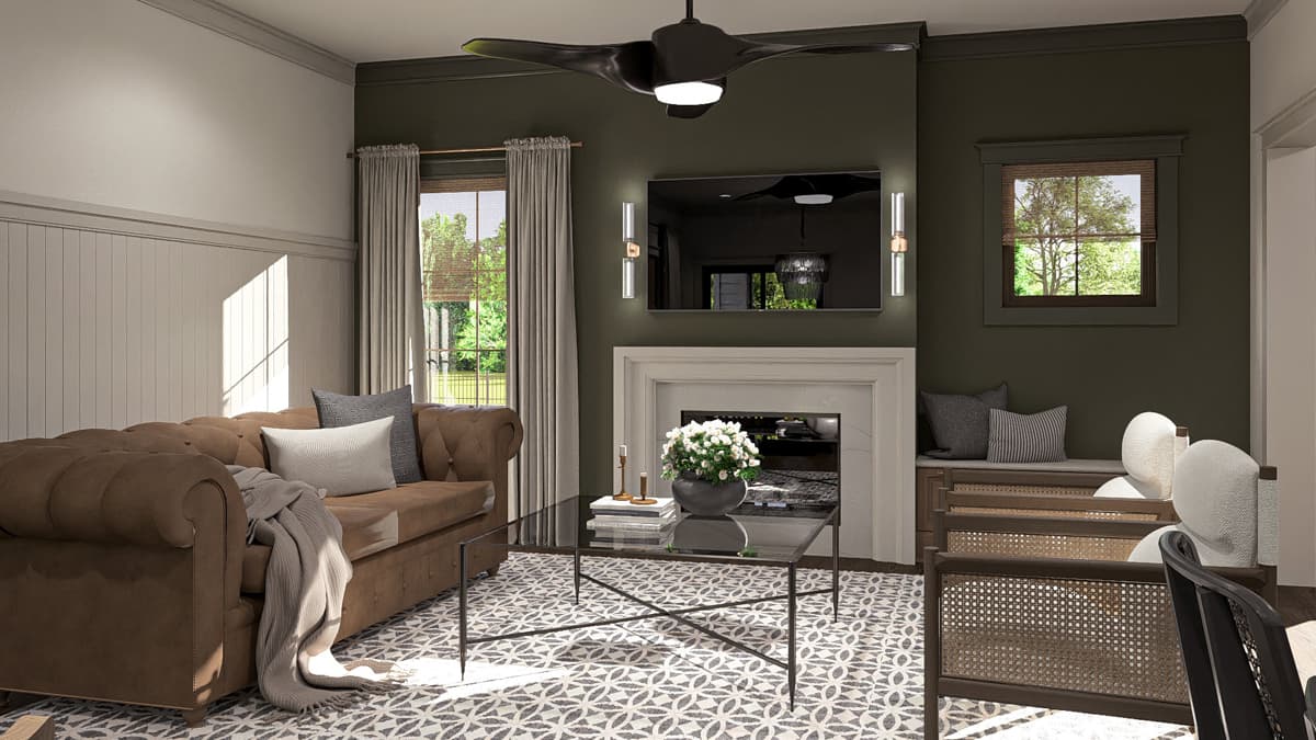 Living room with fireplace, tufted sofa, glass coffee table, and patterned rug. Features wainscoting and dark green walls.