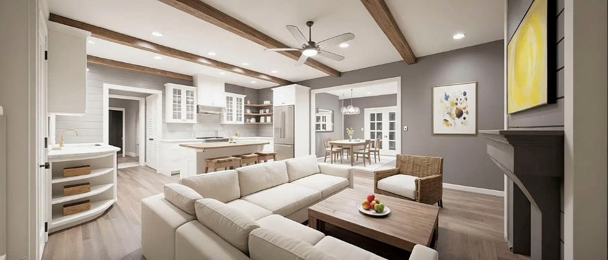 Open concept living area with kitchen island, sectional sofa, fireplace, and dining area with French doors.