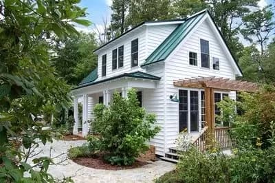 Adorable 3-Bedroom Cottage House Plan with Front and Side Porches - 1112 Sq Ft