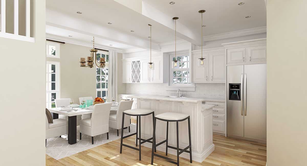 Open concept kitchen and dining area with white cabinetry, large island, and dining table set for four.