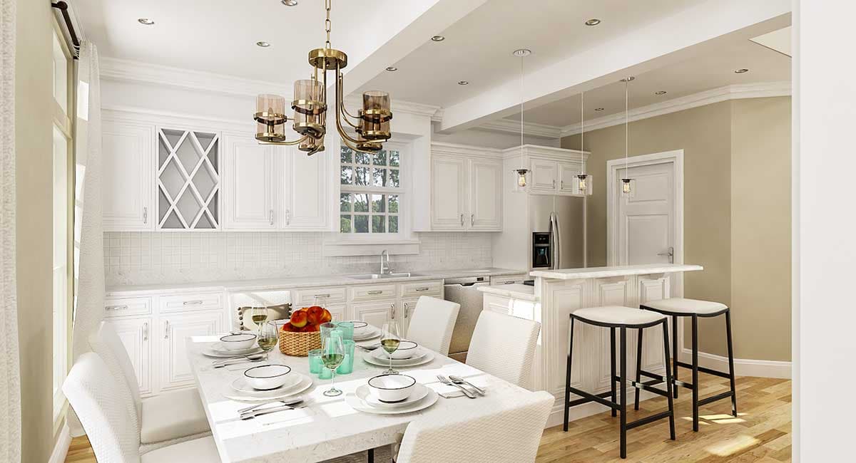 Kitchen and dining area with white cabinets, marble countertops, island with bar seating, and a chandelier.