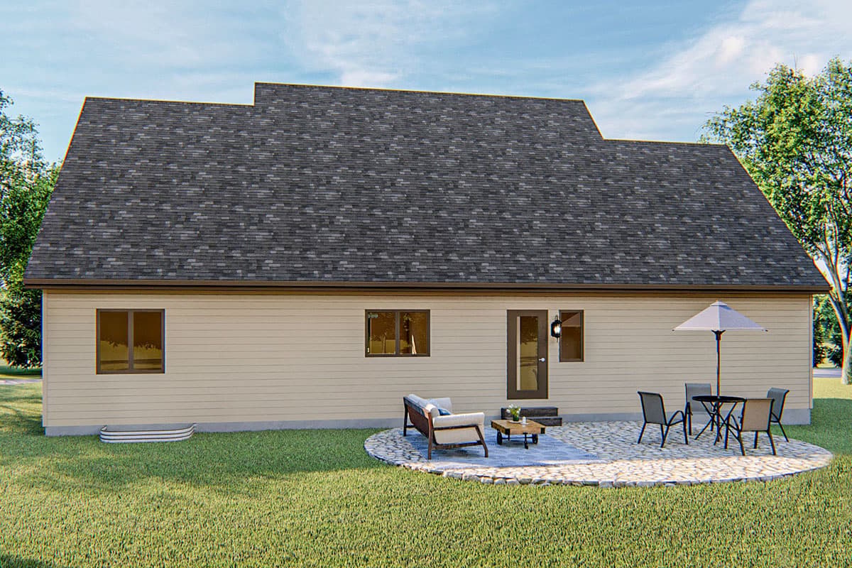House plan exterior: One-story home with horizontal siding, large gable roof, and a small patio with outdoor seating.