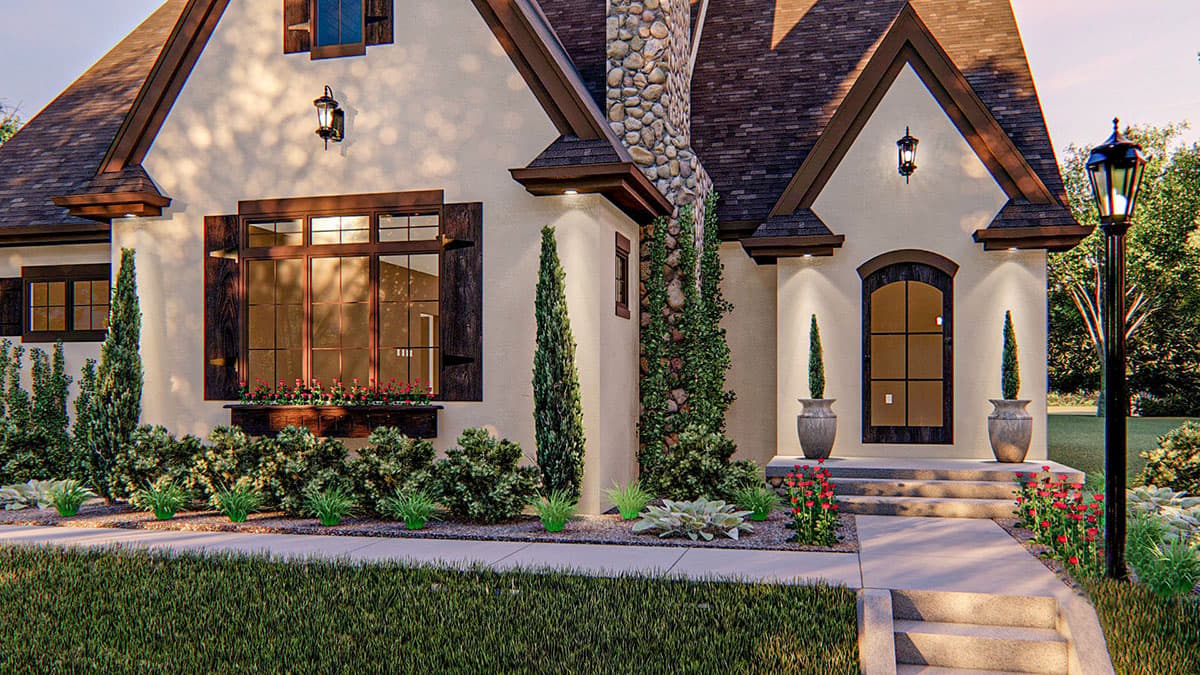 House plan exterior with stone chimney, arched entry, wood shutters, and multiple gables.