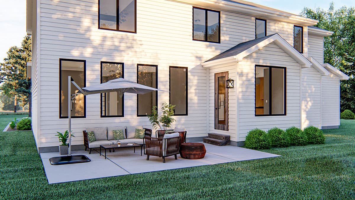 Two-story Modern Farmhouse house plan exterior with white siding, dark-framed windows, gabled entrance, and patio.