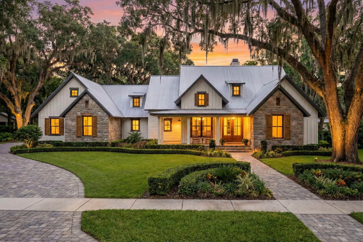 Modern Farmhouse house plan exterior with stone and board-and-batten siding, metal roof, gables, dormers, and covered porch.