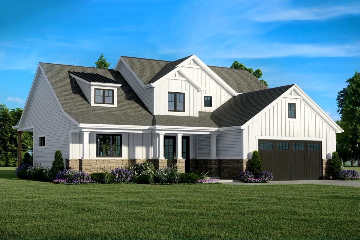 Modern Farmhouse style house plan exterior with white board and batten siding, stone accents, gables, dormers, and a two-car garage.