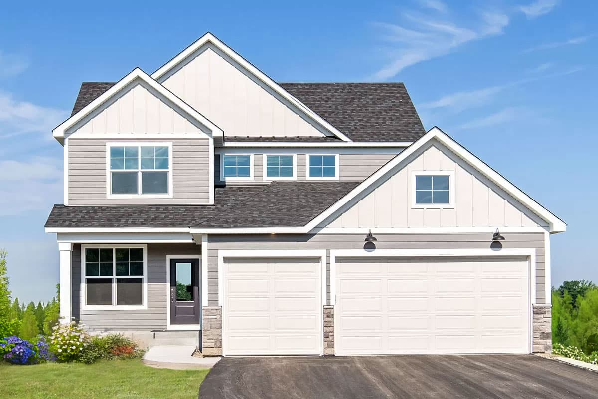 House plan exterior. Two-story, Modern Farmhouse style with gabled rooflines, two-car garage, and a covered porch with a column.