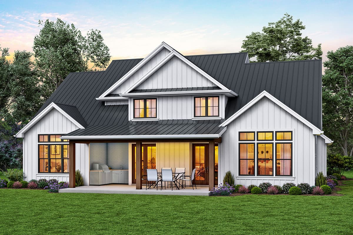 Modern Farmhouse house plan exterior with gabled dormers, covered porch with outdoor kitchen, and metal roof.